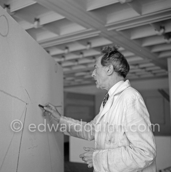 Jean Cocteau, making a drawing for the 6th Cannes Film Festival. Cannes 1953. - Photo by Edward Quinn