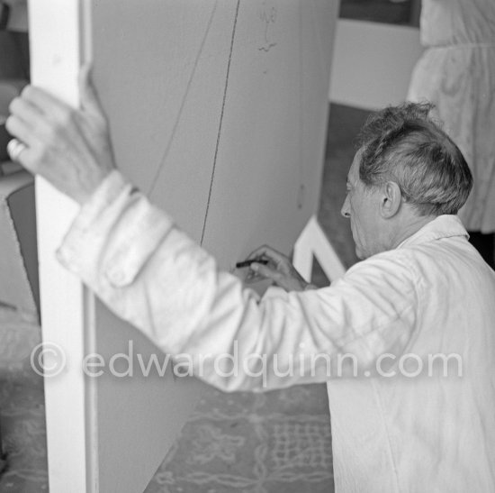 Jean Cocteau, making a drawing for the 6th Cannes Film Festival. Cannes 1953. - Photo by Edward Quinn