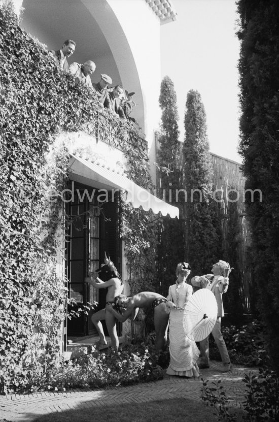 Jean Cocteau acting in his last film "Le Testament d’Orphée". He asked many of his friends to appear, amongst others Francine Weisweiller and on the balcony Italian painters Renato Guttuso and Alberto Magnelli, Pablo Picasso and Pablo Picasso's tailor Michele Sapone. Saint-Jean-Cap-Ferrat 1959. - Photo by Edward Quinn