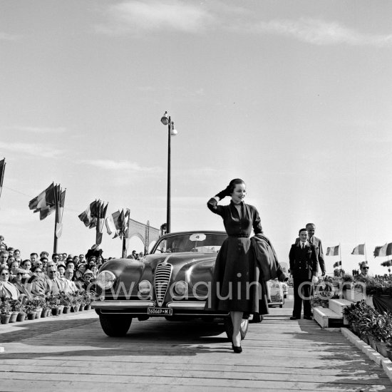 Concours d’Elégance Automobile. Grand Prix d\'Honneur: Alfa Romeo 6C 2500 Villa d\'Este 1949 of Mr. Maillard, with Mrs. Westin who also won "Prix tout dernier cri" (The last word in Fashion). Cannes 1951. - Photo by Edward Quinn