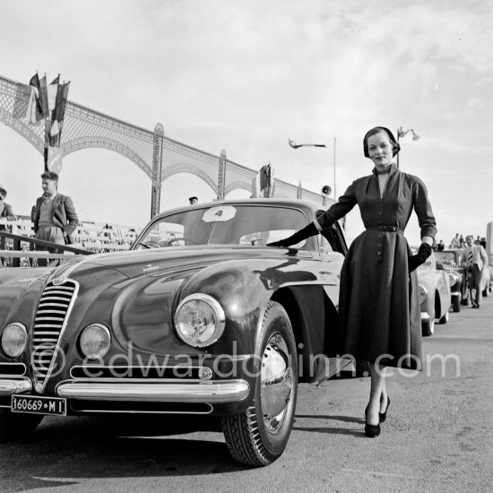 Concours d’Elégance Automobile. Grand Prix d\'Honneur: Alfa Romeo 6C 2500 Villa d\'Este 1949 of Mr. Maillard, with Mrs. Westin who also won "Prix tout dernier cri" (The last word in Fashion). Cannes 1951. - Photo by Edward Quinn