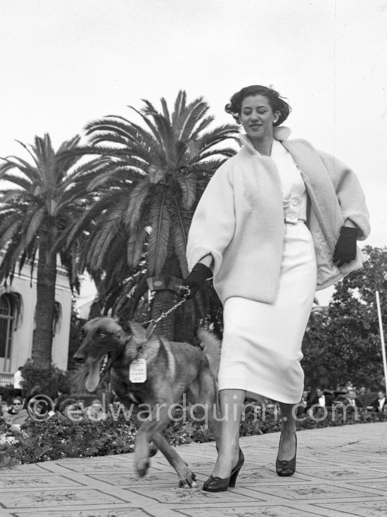 Difficult steps with a German Shepherd Dog. Concours d’élégance, Cannes 1954. - Photo by Edward Quinn