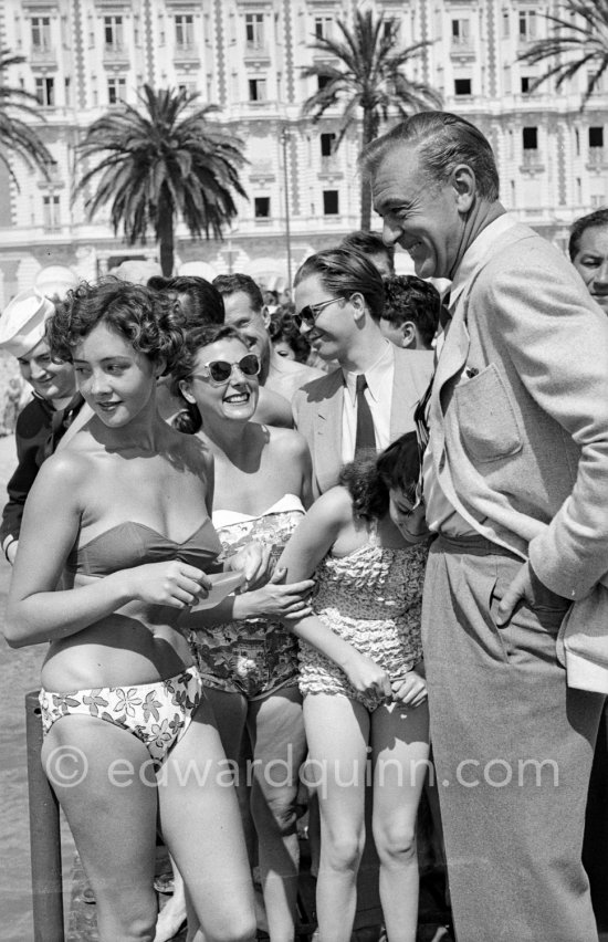 Gary Cooper with admirers, happy to get the star’s signature. Cannes 1953. - Photo by Edward Quinn