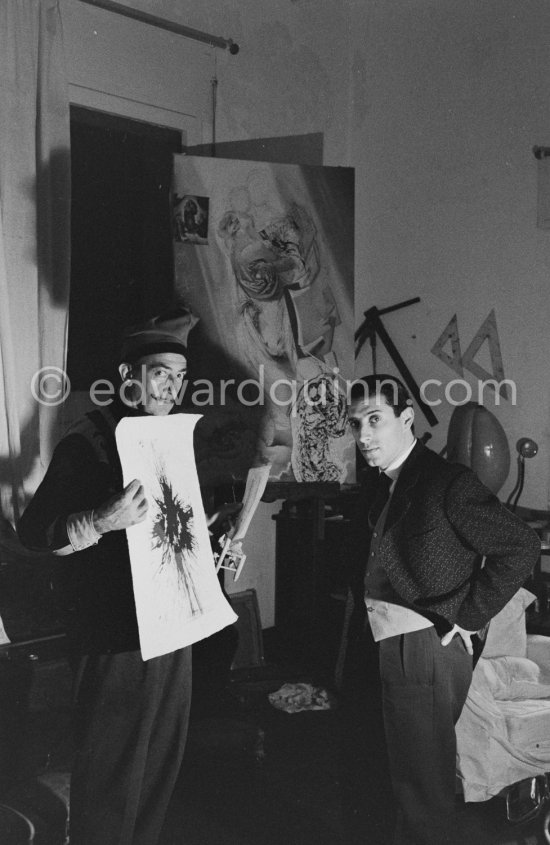 Salvador Dalí and French painter Raymond Moretti. At Dalí\'s house, Portlligat, Cadaqués, 1957. - Photo by Edward Quinn