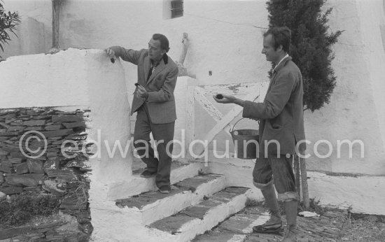 Salador Salvador Dalí and a not yet identified young man with sea urchins Salvador Dalí used for his painting work. Portlligat, Cadaqués,1957. - Photo by Edward Quinn