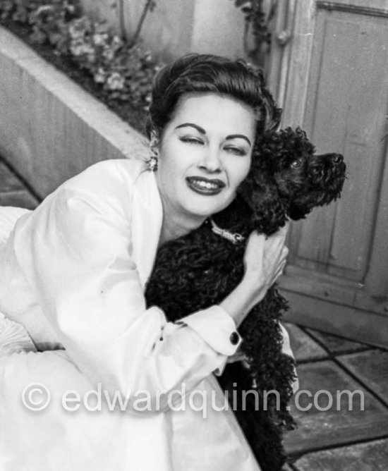 Yvonne de Carlo with a poodle. party at Château de l’Horizon during Cannes Film Festival. Golfe-Juan 1952 - Photo by Edward Quinn