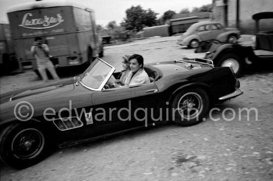 Alain Delon and Jane Fonda arriving at the film set of "Les Félins" ("Love Cage"). Ferrari 250 GT Spider California 1961. Antibes 1964. This car of Alain Delon was hammered 2015 for a record-breaking $18.5 million at an auction at Artcurial in Paris. The 250 GT Spyder California, Chassis No 2935, had been bought new by the actor Gérard Blain, then sold to fellow actor Alain Delon, who was photographed several times at the wheel of this machine, including in 1964. One of 37 examples, this Pininfarina-designed cabriolet, its whereabouts unknown to marque historians until now, is bound to attract the attention of collectors of important historic Ferrari. - Photo by Edward Quinn