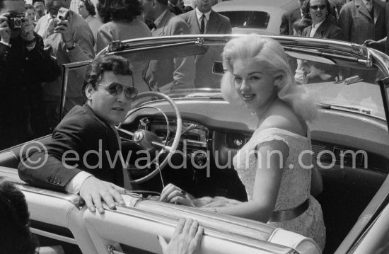 Diana Dors and husband Dennis Hamilton. Cannes Film Festival 1956. Car: Cadillac 1955 Series 62, Style 6267x Convertible - Photo by Edward Quinn