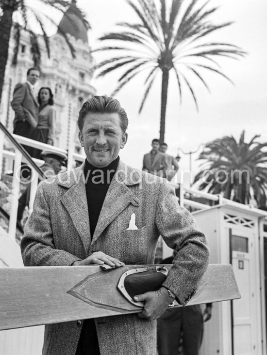 Kirk Douglas with waterski in front of the Carlton Hotel. Cannes Film Festival 1953. - Photo by Edward Quinn