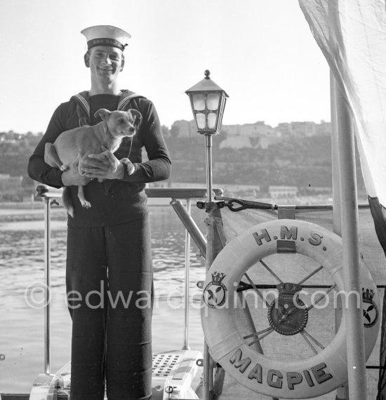 A sailor of HMS Magpie with its mascot "Ginger". The ship was the only vessel commanded by Prince Philip, Duke of Edinburgh, who took command on 2 September 1950, when he was 29. The Duke of Edinburgh was on an official 5-days visit with the Royal Fleet to Monte Carlo, Feb. 1951 - Photo by Edward Quinn