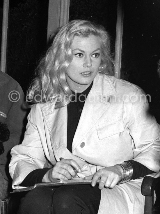 Swedish actress Anita Ekberg buying two Tiny Poodles at a kennel. Nice 1960. - Photo by Edward Quinn