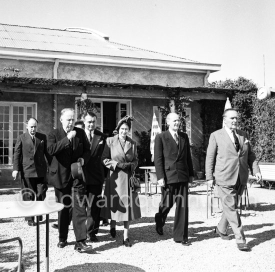 The onlookers saw Princess Elizabeth, later Queen Elizabeth II, very stylishly dressed disembarking from a Viking aircraft during the stop she made at Nice Airport, while on a flight from London to Malta where she was going to meet the Duke of Edinburgh, Prince Philip. She was greeted by local officials. Nice 19.3.1951. - Photo by Edward Quinn