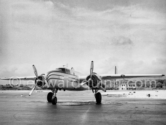 The private plane of Porfirio Rubirosa, a converted North American B-25 Mitchell, at Cannes Airport in 1954. North American B-25 Mitchell B-25H-1NA 43-4432 (N10V). See https://bit.ly/2XS08rs. Was as "Berlin Express" in the 1970 movie Catch-22. Today at Eagle Hangar, EAA Aviation Museum, Oshkosh. - Photo by Edward Quinn