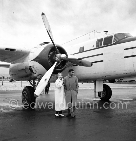 Zsa Zsa Gabor and Porfirio Rubirosa in front of the private plane of Porfirio Rubirosa, a converted North American B-25 Mitchell, at Cannes Airport in 1954. North American B-25 Mitchell B-25H-1NA 43-4432 (N10V). See https://bit.ly/2XS08rs. Was as "Berlin Express" in the 1970 movie Catch-22. Today at Eagle Hangar, EAA Aviation Museum, Oshkosh. - Photo by Edward Quinn