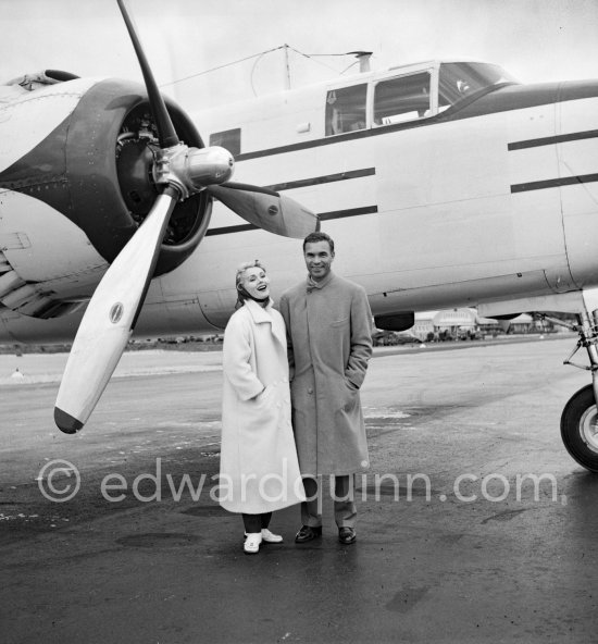 Zsa Zsa Gabor and Porfirio Rubirosa in front of the private plane of Porfirio Rubirosa, a converted North American B-25 Mitchell, at Cannes Airport in 1954. North American B-25 Mitchell B-25H-1NA 43-4432 (N10V). See https://bit.ly/2XS08rs. Was as "Berlin Express" in the 1970 movie Catch-22. Today at Eagle Hangar, EAA Aviation Museum, Oshkosh. - Photo by Edward Quinn