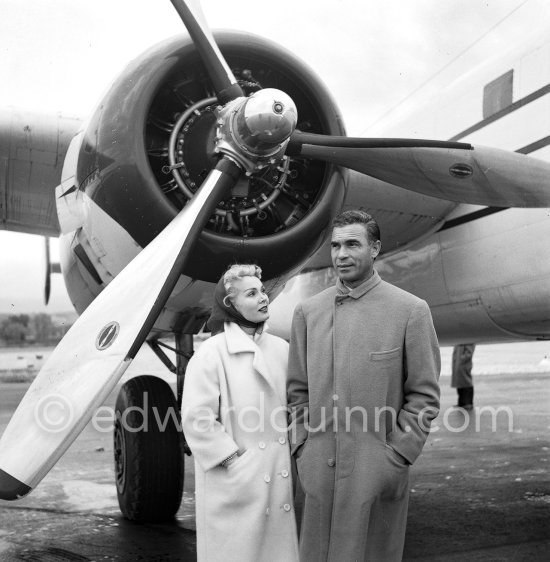 Zsa Zsa Gabor and Porfirio Rubirosa in front of the private plane of Porfirio Rubirosa, a converted North American B-25 Mitchell, at Cannes Airport in 1954. North American B-25 Mitchell B-25H-1NA 43-4432 (N10V). See https://bit.ly/2XS08rs. Was as "Berlin Express" in the 1970 movie Catch-22. Today at Eagle Hangar, EAA Aviation Museum, Oshkosh. - Photo by Edward Quinn