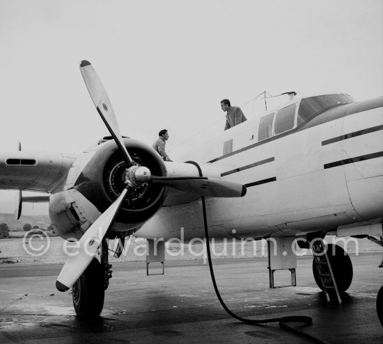 Porfirio Rubirosa on his private plane, a converted North American B-25 Mitchell, at Cannes Airport in 1954. North American B-25 Mitchell B-25H-1NA 43-4432 (N10V). See https://bit.ly/2XS08rs. Was as "Berlin Express" in the 1970 movie Catch-22. Today at Eagle Hangar, EAA Aviation Museum, Oshkosh. - Photo by Edward Quinn