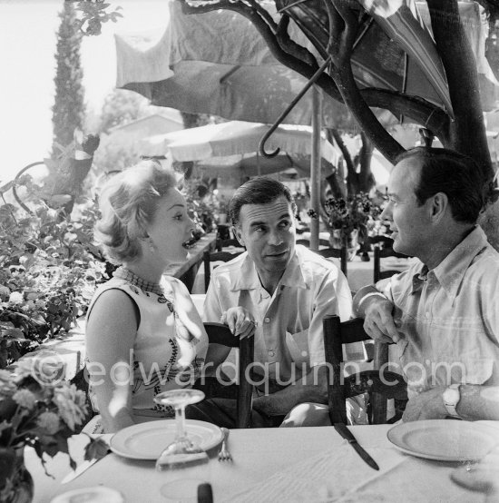 Zsa Zsa Gabor, Porfirio Rubirosa and Earl Blackwell, a society impresario who made his fortune keeping track of celebrities, at the restaurant Colombe d\'Or, Saint-Paul-de-Vence 1953. - Photo by Edward Quinn