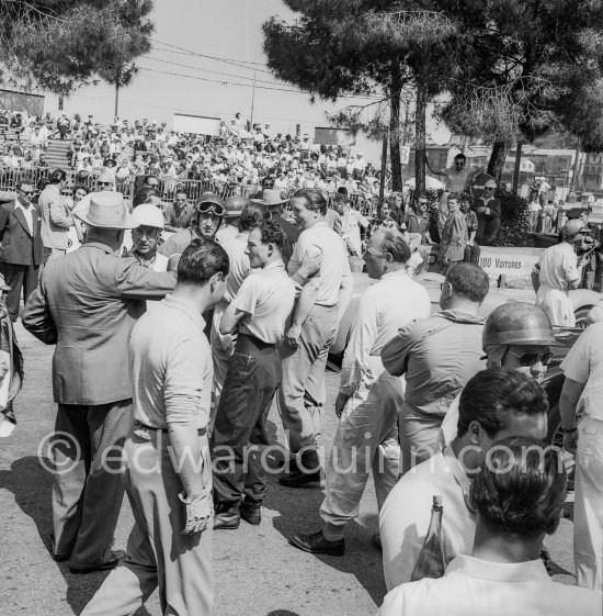 Last instructions to the drivers by Race Director, (Directeur de Course) Charles Faroux, (with hat). Tommy Wisdom with dark helmet, Stirling Moss, Reginald Parnell, Anthony Hume. Monaco Grand Prix 1952, transformed into a race for sports cars. This was a two day event, the Sunday, Prix Monte Carlo, for the up to 2 litres (Prix de Monte Carlo), the Grand Prix, Monday for the bigger engines, (Monaco Grand Prix). - Photo by Edward Quinn