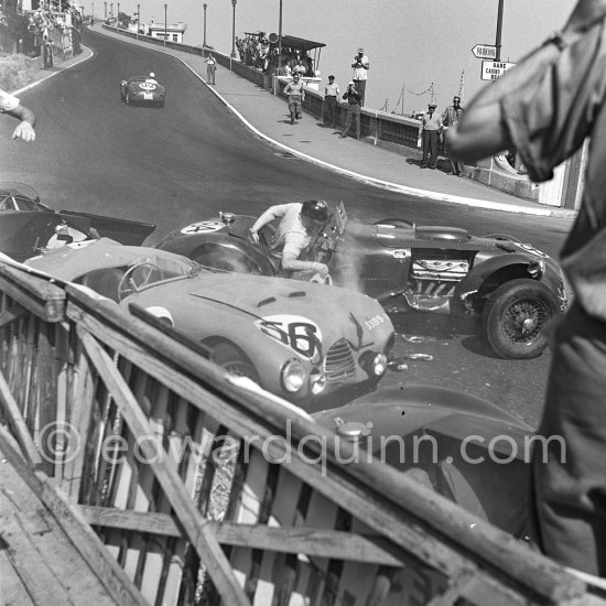 The accident at Sainte-Dévote: Reg Parnell, (72) Aston Martin DB3, Anthony Hume, (84) Allard J7, Robert Manzon, (56) Simca Gordini T15S, Stirling Moss, (78) Jaguar C. The Aston engine of Parnell blows up in the Ste-Devote and aligns his car against the straw bales, Stagnoli brakes too hard and does a double spin. Moss, Jaguar C-Type XKC 003 and Manzon find an obstructed road, spin and end up against the poor Aston, then Hume spins and reverses into the pile. Fortunately nobody gets hurt. Moss restarted after the accident, but got a black flag for receiving outside help. Monaco Grand Prix 1952, transformed into a race for sports cars. This was a two day event, the Sunday, Prix Monte Carlo, for the up to 2 litres (Prix de Monte Carlo), the Grand Prix, Monday for the bigger engines, (Monaco Grand Prix). - Photo by Edward Quinn