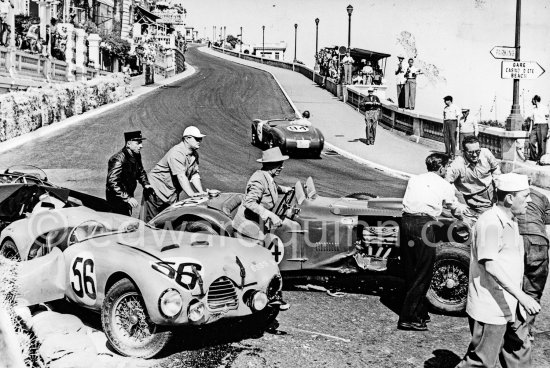 The accident at Sainte-Dévote: Hume, (84) Allard J7, Manzon, (56) Simca Gordini T15S. The Aston engine of Parnell blows up in the Ste-Devote and aligns his car against the straw bales, Stagnoli brakes too hard and does a double spin. Moss, Jaguar C-Type XKC 003 and Manzon find an obstructed road, spin and end up against the poor Aston, then Hume spins and reverses into the pile. Fortunately nobody gets hurt. Moss restarted after the accident, but got a black flag for receiving outside help. Monaco Grand Prix 1952, transformed into a race for sports cars. This was a two day event, the Sunday, Prix Monte Carlo, for the up to 2 litres (Prix de Monte Carlo), the Grand Prix, Monday for the bigger engines, (Monaco Grand Prix). - Photo by Edward Quinn