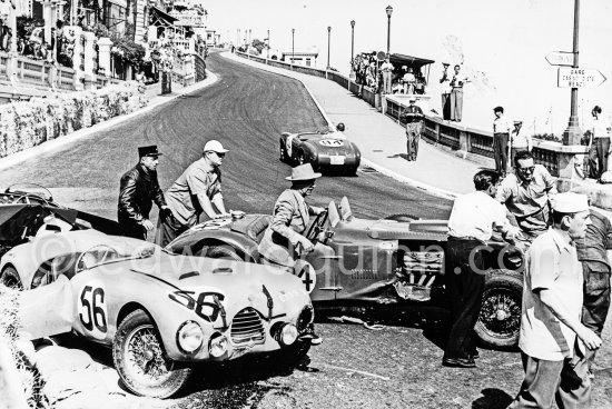 The accident at Sainte-Dévote: Hume, (84) Allard J7, Manzon, (56) Simca Gordini T15S. The Aston engine of Parnell blows up in the Ste-Devote and aligns his car against the straw bales, Stagnoli brakes too hard and does a double spin. Moss, Jaguar C-Type XKC 003 and Manzon find an obstructed road, spin and end up against the poor Aston, then Hume spins and reverses into the pile. Fortunately nobody gets hurt. Moss restarted after the accident, but got a black flag for receiving outside help. Monaco Grand Prix 1952, transformed into a race for sports cars. This was a two day event, the Sunday, Prix Monte Carlo, for the up to 2 litres (Prix de Monte Carlo), the Grand Prix, Monday for the bigger engines, (Monaco Grand Prix). - Photo by Edward Quinn