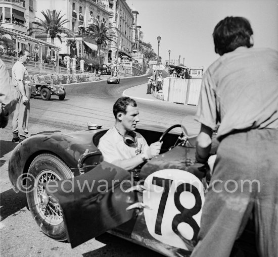 The accident at Sainte-Dévote: Stirling Moss, (78) restarts his Jaguar C-Type XKC 003 but got a black flag for receiving outside help. Monaco Grand Prix 1952, transformed into a race for sports cars. This was a two day event, the Sunday, Prix Monte Carlo, for the up to 2 litres (Prix de Monte Carlo), the Grand Prix, Monday for the bigger engines, (Monaco Grand Prix). The Aston engine of Parnell blows up in the Ste-Devote and aligns his car against the straw bales, Stagnoli brakes too hard and does a double spin. Moss, Jaguar C-Type XKC 003 and Manzon find an obstructed road, spin and end up against the poor Aston, then Hume spins and reverses into the pile. Fortunately nobody gets hurt. - Photo by Edward Quinn