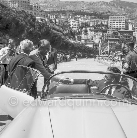 Prince Rainier greeting Louis Chiron, Monégasque racing driver and GP organizer, before his parade lap before the start of the Monaco Grand Prix 1955. Car: Lancia Aurelia B24 Spider America Cabriolet 1955 - Photo by Edward Quinn