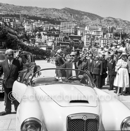 Rainier III, Prince of Monaco before his parade lap before the start of the Monaco Grand Prix on 25th 1955. Car: Lancia Aurelia B24 Spider America Cabriolet 1955 - Photo by Edward Quinn