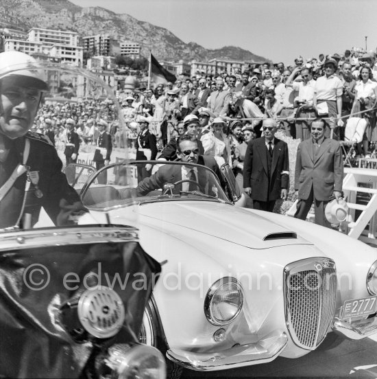 Rainier III, Prince of Monaco before his parade lap before the start of the Monaco Grand Prix on 25th 1955. Car: Lancia Aurelia B24 Spider America Cabriolet 1955 - Photo by Edward Quinn