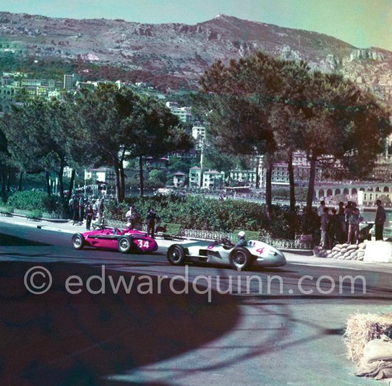 Jean Behra, (34) Maserati 250F, André Simon, (4) Mercedes-Benz W196. With the shadow of the gazomètre. Monaco Grand Prix 1955. - Photo by Edward Quinn