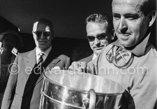 Prince Rainier presents winner Maurice Trintignant with the splendid "Coupe du Grand Prix". Monaco Grand Prix 1955. - Photo by Edward Quinn