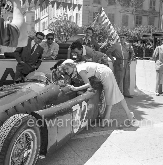 During filming of "The Racers" on the occasion of Monaco Grand Prix 1955: Bella Darvi, Polish French actress, supposed to be a flirt of Prince Rainier, with a mechanic. Lancia D50 of Louis Chiron. Monaco 1955. Monaco Grand Prix 1955. - Photo by Edward Quinn