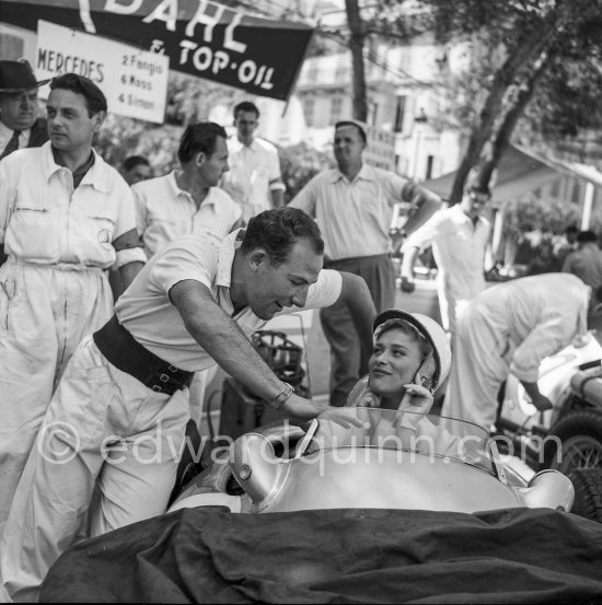Stirling Moss and in his Mercedes-Benz W 196 (6) Bella Darvi, who had a leading role in the film "The Racers". Monaco Grand Prix 1955. - Photo by Edward Quinn