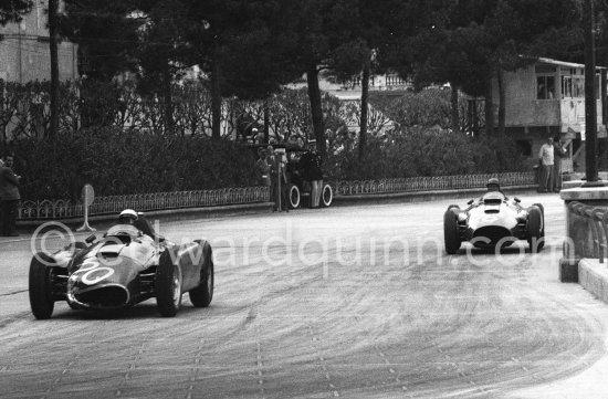 Eugenio Castellotti on Fangio\'s (20) Ferrari-Lancia D50. Fangio in the car of Collins, (26) Ferrari-Lancia D50. Monaco Grand Prix 1956. - Photo by Edward Quinn