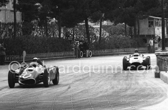 Eugenio Castellotti on Fangio\'s (20) Ferrari-Lancia D50. Fangio in the car of Collins, (26) Ferrari-Lancia D50. Monaco Grand Prix 1956. - Photo by Edward Quinn