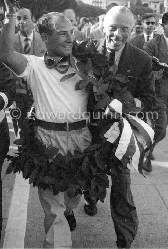 The winner: Stirling Moss on Maserati 250F with a commissaire sportive. Monaco Grand Prix 1956. - Photo by Edward Quinn