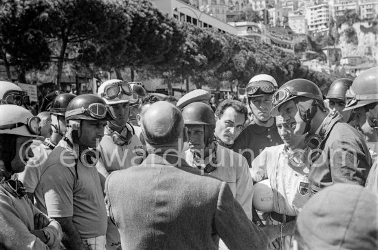 Driver\'s briefing, from left Maurice Trintignant, Juan Manuel Fangio, Harry Schell, Carlos Menditeguy, Peter Collins, Giorgio Scarlatti, Wolfgang von Trips, Stirling Moss, Mike Hawthorn, Jack Brabham, Ivor Bueb. Monaco Grand Prix 1957. - Photo by Edward Quinn