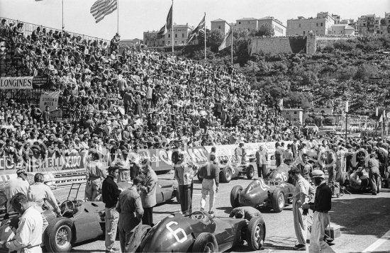 Starting grid in front of Tribune Quai Albert-1er. Carlos Mediteguy, (36) Maserati 250F, Harry Schell, (38) Maserati 250F, Maurice Trintignant, (30) Ferrari-Lancia, Wolfgang von Trips, (24) Ferrari 80I, Masten Gregory, (2) Maserati 250F, Ron Flockhart, (6) B.R.M. P25, Horace H. Gould, (22). Monaco Grand Prix 1957. - Photo by Edward Quinn
