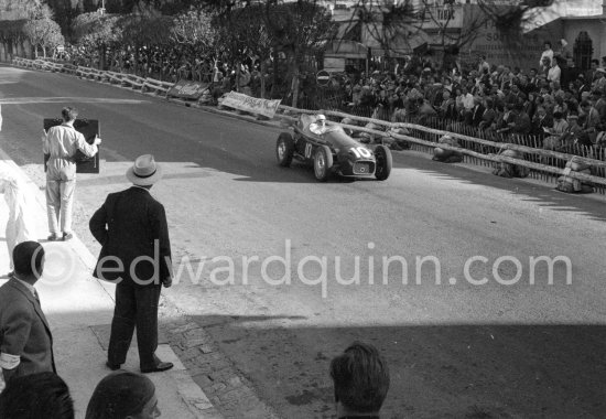 Stewart Lewis-Evans, (10) Connaught B. With white hat Tony Vandervell, head of the Vanwall Formula One racing team. Monaco Grand Prix 1957. When Vandervell was asked why he ploughed his fortune into building a British Grand Prix team he said, dismissively, \'Some people play golf, I play cars.\' - Photo by Edward Quinn