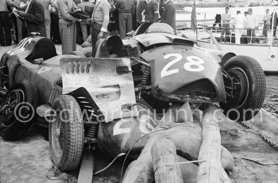 After the race: The cars of Mike Hawthorn, (28) Ferrari-Lancia D50 and Peter Collins, (26) Ferrari 801 in the barriers while Wolfgang von Trips, (24) Ferrari 80I, passes. The incident happend in lap 4 of the 1957 Monaco Grand Prix after leader Stirling Moss "lost" his Vanwall in the chicane. Peter Collins swerved to avoid Moss but hit the wall while Mike Hawthorn rammed Tony Brooks who braked hard to avoid the cars in front of him. - Photo by Edward Quinn