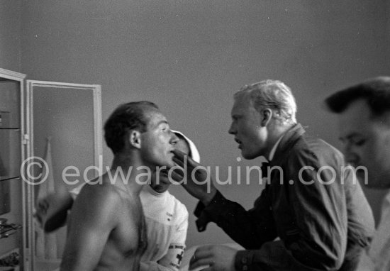 Mike Hawtorn and Stirling Moss at the hospital after their accident in lap 4. Here is Hawthorn looking at Stirling Moss who had his nose injured. Monaco Grand Prix 1957. - Photo by Edward Quinn