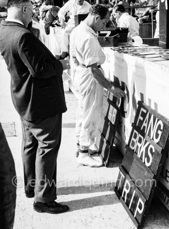 Stirling Moss with a pit board.and Tony Vandervell, head of the Vanwall Formula One racing team. Grand Prix Monaco 1957. - Photo by Edward Quinn