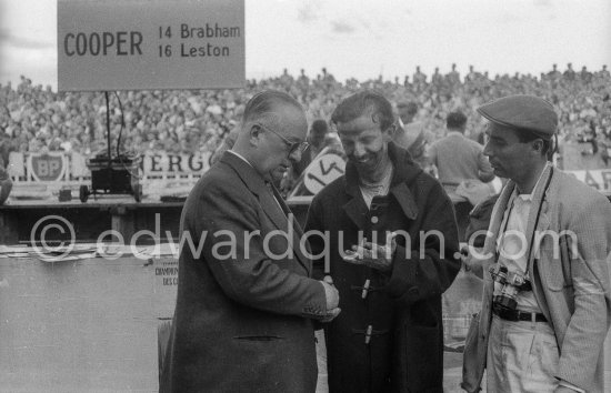 "Speeding dentist" Tony Brooks shows his skinless hands to Tony Vandervell, head of the Vanwall Formula One racing team. Monaco Grand Prix 1957. - Photo by Edward Quinn