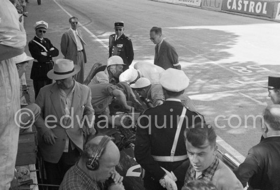 Stirling Moss, (28) Vanwall VW7, stops at the pits with valve problems. Tony Vandervell (white hat), founder of the Vanwall Formula One racing team. Monaco Grand Prix 1958. - Photo by Edward Quinn