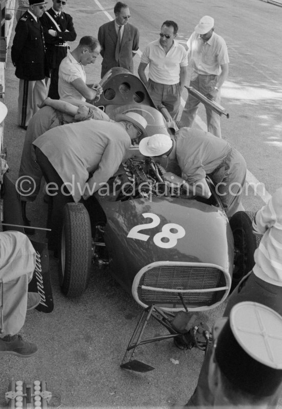 Stirling Moss, (28) Vanwall VW7, stops at the pits with valve problems. Tony Vandervell (white hat), founder of the Vanwall Formula One racing team. Monaco Grand Prix 1958. - Photo by Edward Quinn