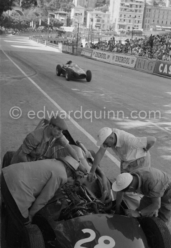 Stirling Moss, (28) Vanwall VW7, stops at the pits with valve problems. Tony Vandervell (white hat), founder of the Vanwall Formula One racing team. Monaco Grand Prix 1958. - Photo by Edward Quinn