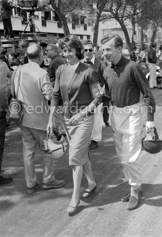 Pina, Tony Brooks Italian wife, carries an extra helmet and goggles for her husband. Monaco Grand Prix 1959. - Photo by Edward Quinn