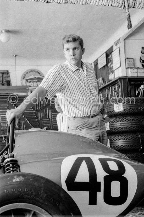 In a backstreet garage of Monte Carlo, Lance Reventlow, the driver-owner-constructor, helps to prepare his Scarab car for the race. Monaco Grand Prix 1960. - Photo by Edward Quinn
