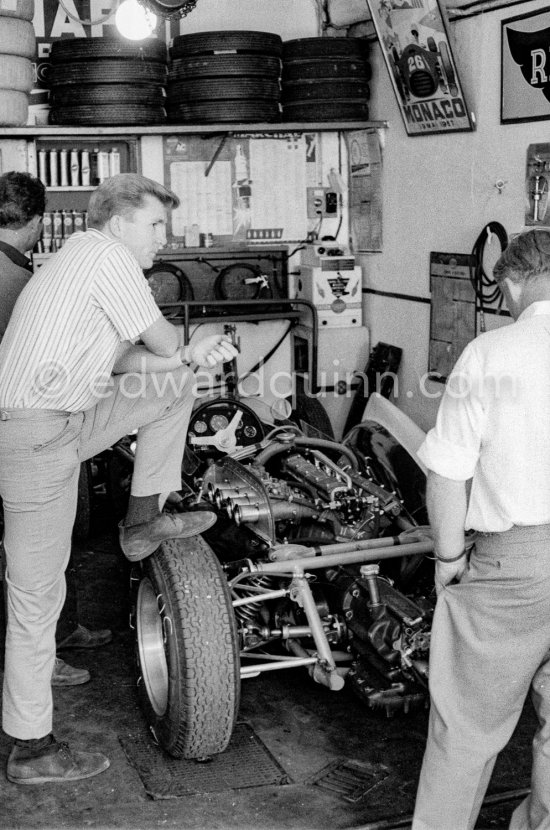 In a backstreet garage of Monte Carlo, Lance Reventlow, the driver-owner-constructor, helps to prepare his Scarab car for the race. Monaco Grand Prix 1960. - Photo by Edward Quinn